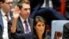 U.S. -- U.S. Ambassador to the United Nations Nikki Haley rises her arm as she votes at a U.N. Security Council meeting over North Korea's new sanctions at the U.N. Headquarters in New York, September 11, 2017