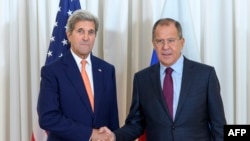 U.S. Secretary of State John Kerry (left) shakes hands with Russian Foreign Minister Sergei Lavrov on August 26 in Geneva.