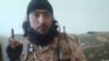 A screen capture from a video of purported Tajik Islamic State militant Abu Kholidi Kulobi. The video appeared online in August 2014.