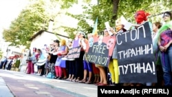 Members of a Serbian women's organization demonstrate against the sentence given to the members of Pussy Riot in Belgrade on September 12.