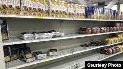 Empty supermarket shelves show the frenzied buying of macaroni by Iranians. May 5, 2019