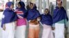 Australia – Religion / Multiculturalism – Muslim women model Australian flag hijabs, Melbourne, 21Mar2006