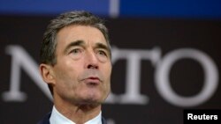 NATO Secretary-General Anders Fogh Rasmussen addresses a news conference during a NATO defense ministers' meeting at alliance headquarters in Brussels on February 21.