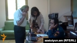 Armenia - Officials at the Vanadzor branch of the Rescue Service answer phone calls from anxious residents after an earthquake, 7Jul2014.