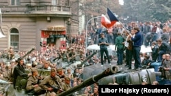Czechoslovakia -- Prague residents surround Soviet tanks in front of the Czechoslovak Radio station building in central Prague during the first day of Soviet-led invasion to then Czechoslovakia, August 21, 1968.