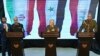  Iran's Chief of Staff of Armed Forces, Maj. Gen. Mohammad Hossein Bagheri, left, speaks during a press conference with Syria's defense minister Gen. Ali Ayoub, center, and Iraqi army commander, Gen. Osman Ghanemi in Damascus, Syria, Monday, March 18, 201