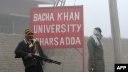 Pakistani security personnel stand near Bacha Khan University in Charsadda on January 25.