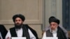 FILE: Taliban chief negotiators Mohammad Abbas Stanikzai (R) and Mullah Abdul Ghani Baradar during talks with senior Afghan politicians in Moscow in May.