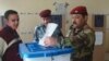 Iraqi soldiers vote early in Amara on March 4.