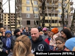 Monson addresses students at a school in Moscow.