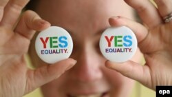 Angela McGlanaghey displays badges in favor of same-sex marriage in Donegal, Ireland.