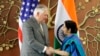 Indian Foreign Minister Sushma Swaraj greets U.S. Secretary of State Rex Tillerson in New Delhi on October 25. 