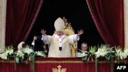 Pope Benedict XVI delivers his Easter message and blessing to Catholics from St Peter's Basilica at the Vatican.