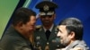 Deadly embrace? Venezuela's Hugo Chavez and Iran's Mahmud Ahmadinejad at a welcoming ceremony in Tehran in April 2009.