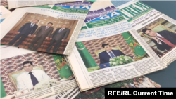  Кадр из газет Туркменистана с фотографией президента на обложке.