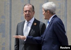 U.S. Secretary of State John Kerry (right) and Russian Foreign Minister Sergei Lavrov in Sochi on May 12