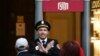 A security guard blocks the entrance to the GUM shopping center in central Moscow on September 14 after a bomb threat was phoned in.