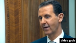 GRAB - Assad Denies Chemical Attack