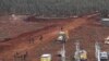 An Israeli military digger works on the Lebanese-Israeli border next to a wall that was built by Israel in the southern village of Kafr Kila, Lebanon, Tuesday, Dec. 4, 2018. The Israeli military launched an operation on Tuesday to "expose and thwart" tunn