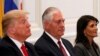 U.S. President Donald Trump (L), Secretary of State Rex Tillerson (C) and Ambassador to the U.N. Nikki Haley (R) attend a working dinner with Latin American leaders in New York, U.S., September 18, 2017