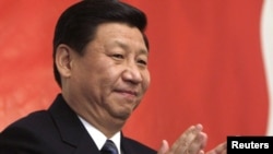 Си Цзиньпин, заместитель председателя Центрального военного совета Компартии Китая .