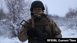 A Ukrainian servicemen near the front line in Luhansk 