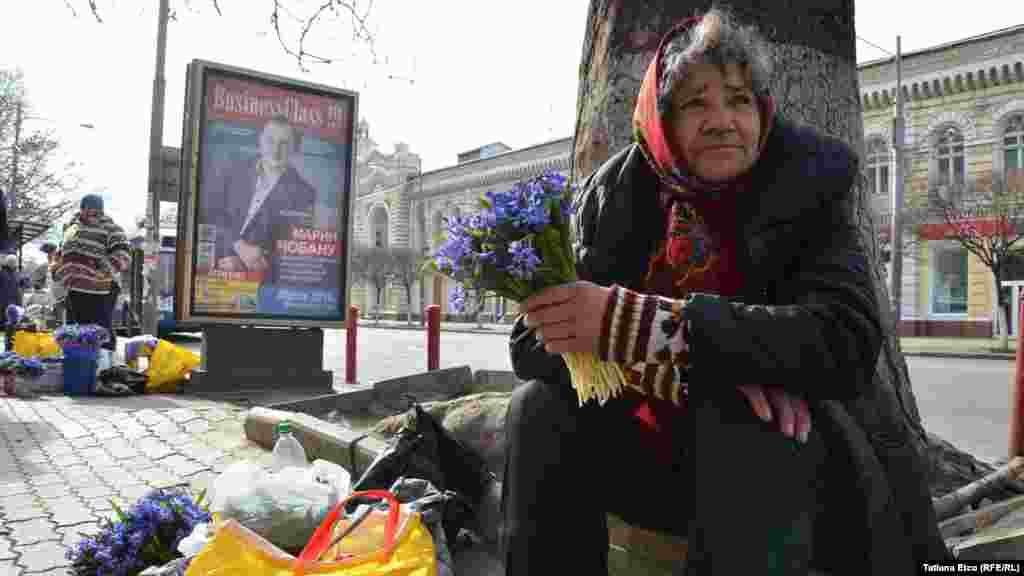 A woman sells flowers in Chisinau.