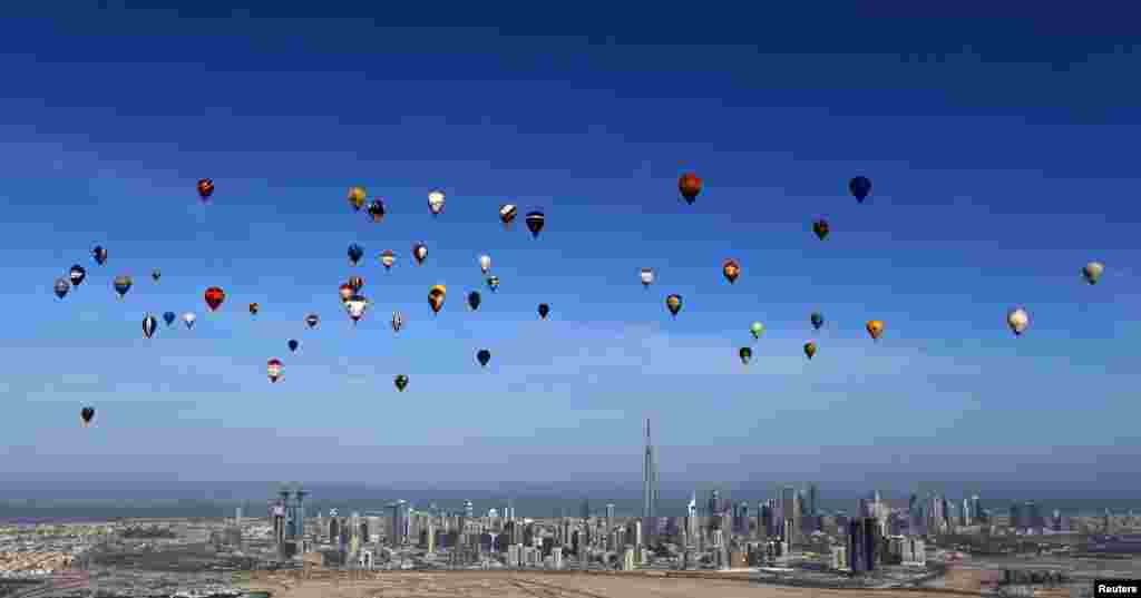 Hot air balloons fly over Dubai during the World Air Games 2015. (Reuters/Karim Sahib)