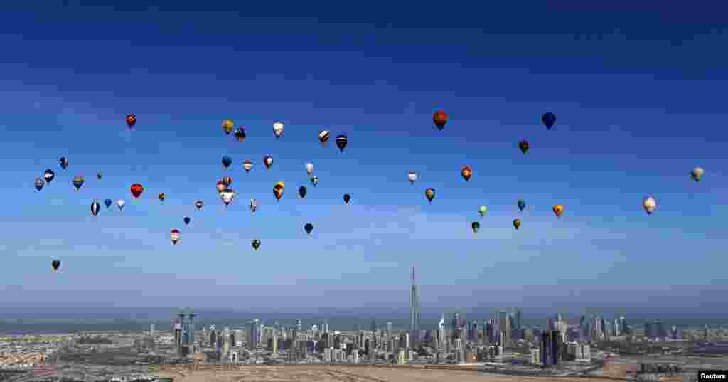 Hot air balloons fly over Dubai during the World Air Games 2015. (Reuters/Karim Sahib)