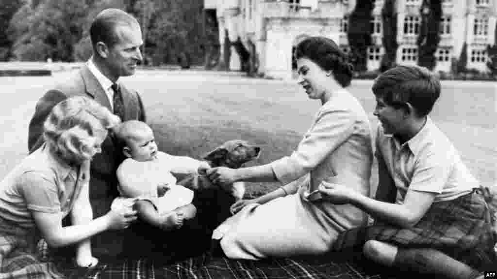 The queen, Prince Philip, and three of their children (Anne, Andrew, and Charles (left-to-right; their fourth child, Prince Edward, was born four years later) at Balmoral Castle in 1960.