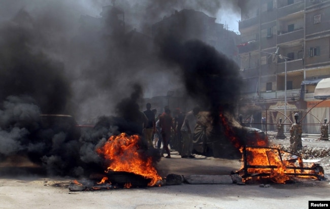 Столкновения членов организации "братья-мусульмане" с полицией в Каире. 14 августа 2014 года