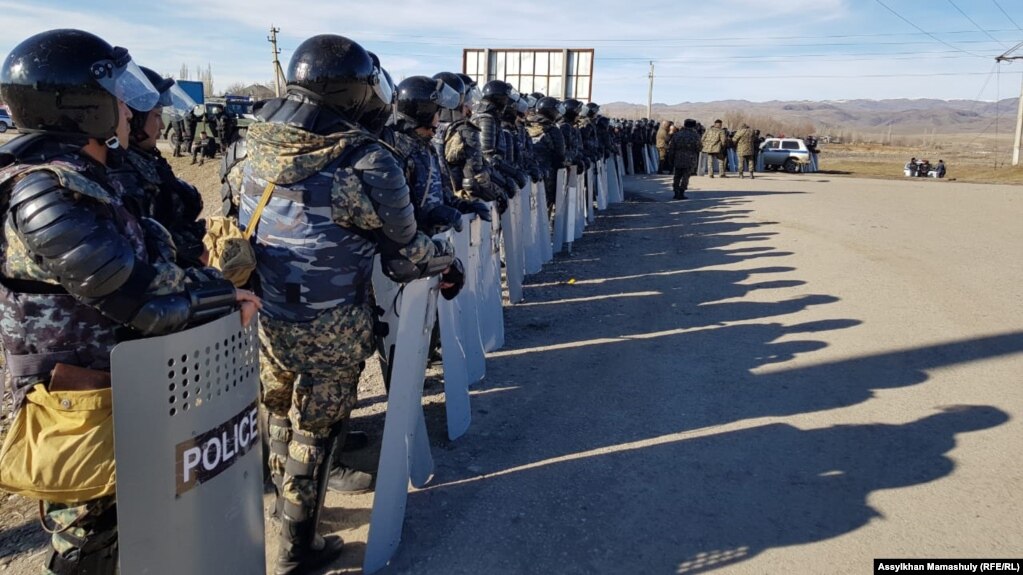 Riot police deployed to the village of Masanchi on February 8.