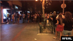 People withdrawing their money from ATMs in Istanbul.