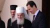 Predsjednik Sirije Bašar al Asad (D) i patrijarh Srpske pravoslavne crkve Irinej (L) tokom susreta u Damasku 3. juna 2019. 