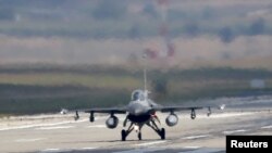 Turkey -- A Turkish Air Force F-16 fighter jet lands at Incirlik air base in Adana, Turkey, August 11, 2015.