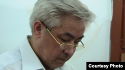 Former Zhanaozen Mayor Zhalghas Babakhanov sits in the court in July.
