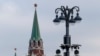 RUSSIA --Surveillance cameras on a lamppost in central Moscow, with Troitskaya Tower of Kremlin behind