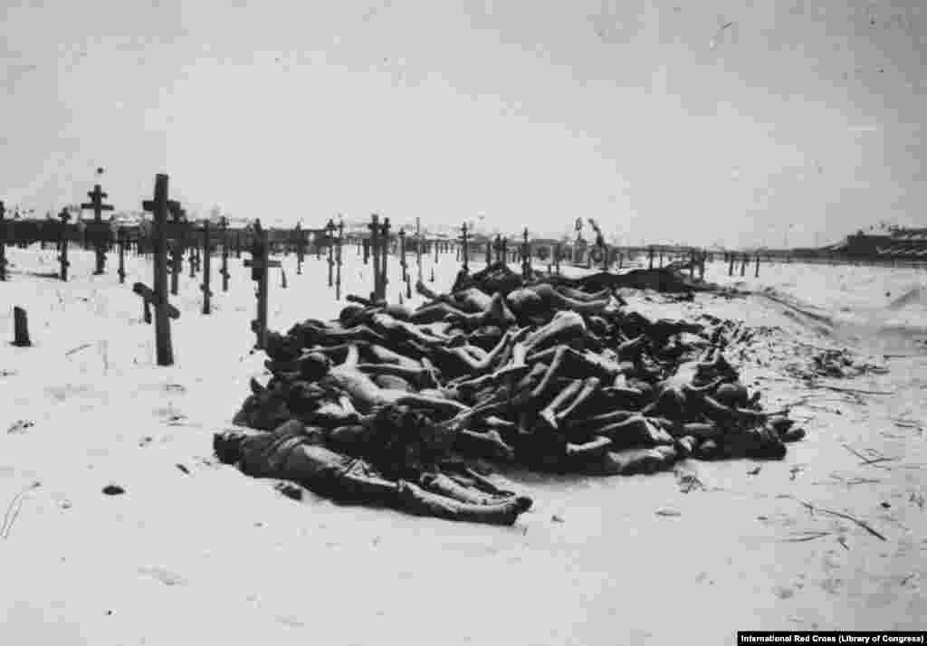 Victims of the famine that followed, stacked like firewood outside a cemetery in Samara in 1921. Eastern Russia at the time was deemed "too chaotic" for aid operations. The famine would soon add more millions to the number of Russian soldiers killed in World War I and the millions killed in the civil war. (photo via International Red Cross)