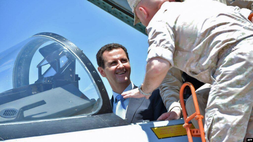 Syrian President Bashar al-Assad sits inside a Sukhoi Su-27 jet during his visit to the Russian air base at Hmeimim on June 27.