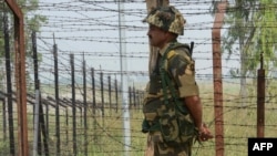An Indian soldier stands guard at the Line of Control between India and Pakistan in the disputed Kashmir region (file photo) 