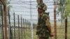 An Indian Border Security Force (BSF) soldier keeps guard at the Chakri post on the India-Pakistan border.