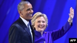 U.S. President Barack Obama (left) and his choice to succeed him, Hillary Clinton, appear at the Democratic National Convention in Philadelphia.