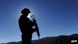 A security guard keeps watch at a mine in Wardak Province.