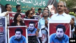 At a rally in Karachi in April 2017, protesters hold up portraits of 23-year-old Mashal Khan, who was killed by a mob of fellow students for alleged blasphemy at Abdul Wali Khan University.