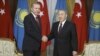 FILE: Kazakh President Nursultan Nazarbaev (R) with his Turkish counterpart Tayyip Erdogan.