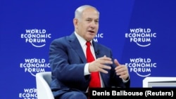 Israel's Prime Minister Benjamin Netanyahu gestures as he speaks the World Economic Forum (WEF) annual meeting in Davos, Switzerland, January 25, 2018