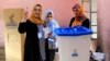 A woman casts her vote at a polling station during the Kurdish independence referendum in Kirkuk on September 25. 