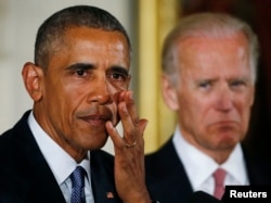 Вице-президент США Джо Байден (справа) назначен Обамой координировать борьбу с главной болезнью 21-го века - раком