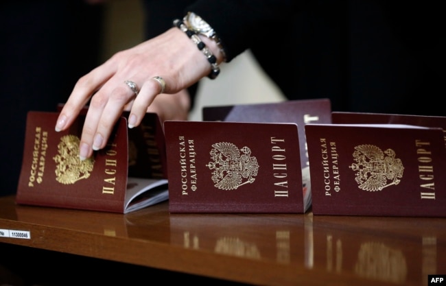 Passports of the Russian Federation on a table as Crimean residents receive them in Simferopol on April 15, 2014.
