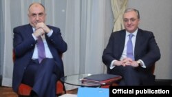 Slovakia -- Foreign Ministers Zohrab Mnatsakanian (R) of Armenia and Elmar Mammadyarov of Azerbaijan meet in Bratislava, December 4, 2019.